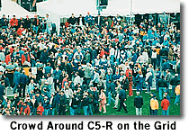 A picture of the crowd gathered around the C5-R racecar after the race