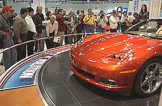 As soon as the L.A. Show opened on Monday the 5th, 100s of Corvette owners and enthusiasts clustered around the C6. Image:  Sharkcom
