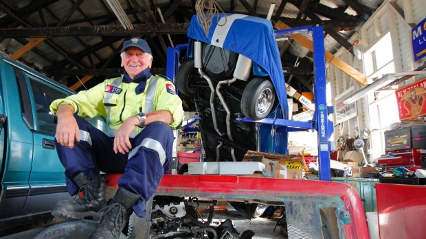 Kaikoura volunteer fire chief Ian Walker with his pride and joy a '72 Corvette which fell of a hoist in his workshop during the earthquake.