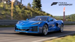 Driver’s side front 3/4 view of 2024 Chevrolet Corvette E-Ray in Riptide Blue driving on a road in Forza Motorsport.